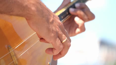 hands playing guitar