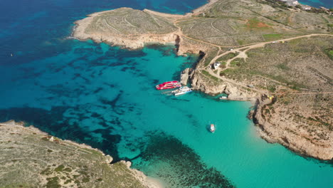 scenic comino island and blue lagoon in malta - aerial drone shot