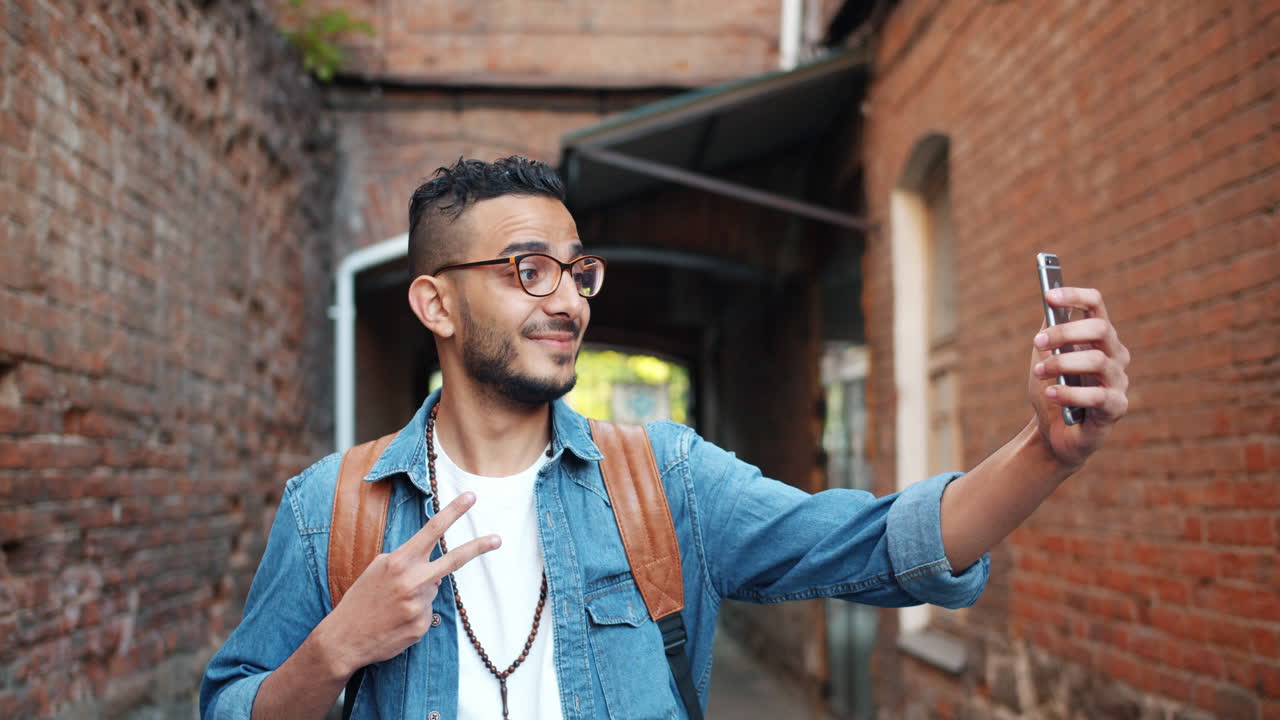 Young man taking a selfie in the city