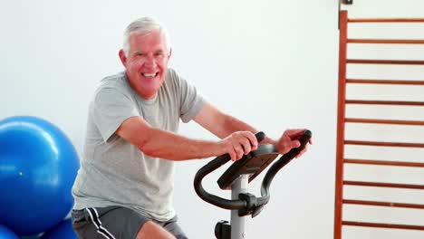 Elderly-man-using-the-exercise-bike-