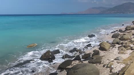 amazing seaside with carved rocks from sea waves and turquoise water in beautiful riviera of albania, top tourist destination spot