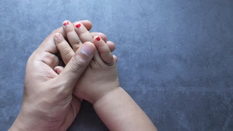 parent and child holding hands