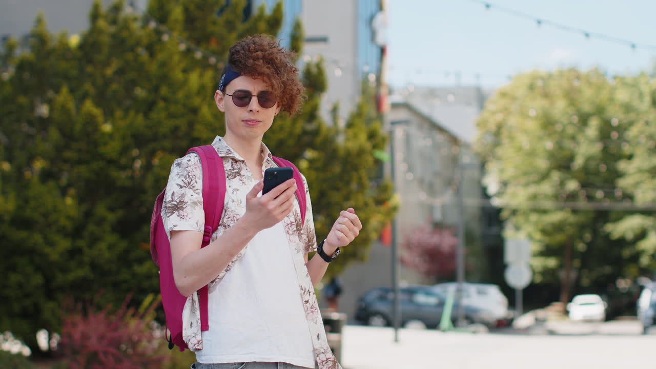 Tourist traveler caucasian man using smartphone looking for search a way on map in mobile navigator