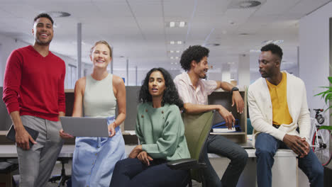 portrait of happy diverse male and female business colleagues in office
