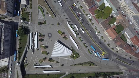 high aerial overhead of traffic and pedestrians walking in city streets