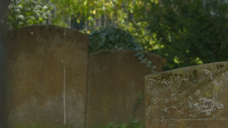 Pull-Focus-Shot-of-Tombstones-In-Oxford-Graveyard-