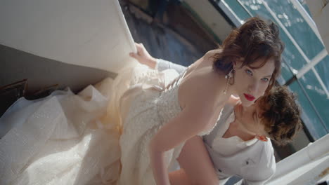 couple in love on a boat wearing wedding attire