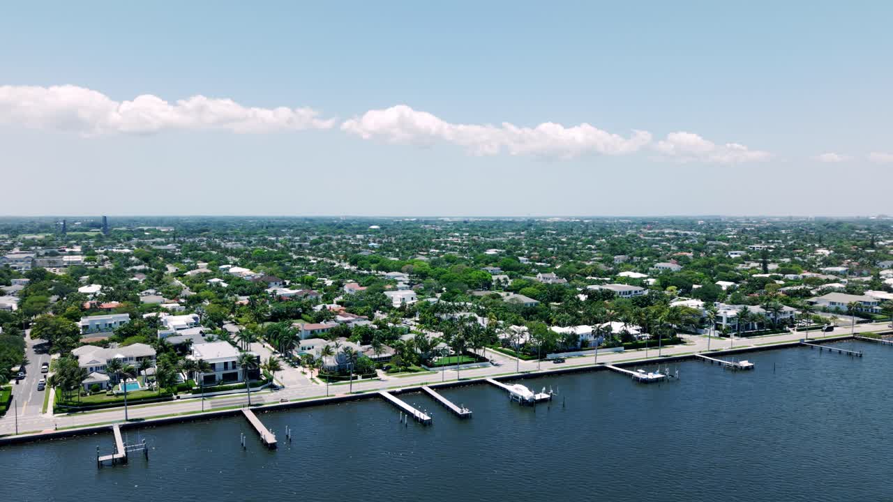 Aerial scene of Flagler Beach coastline with homes, roads, and sea in West Palm Beach