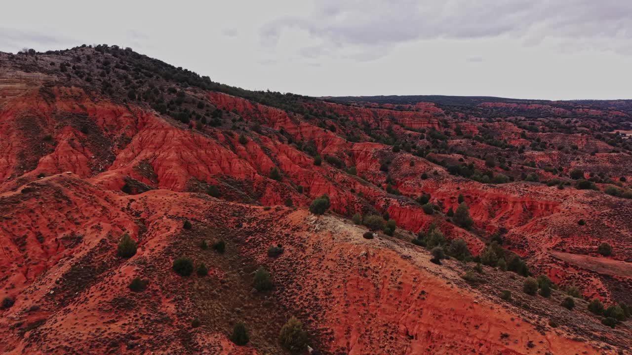 Explore the red hills and valleys of Spain's unique landscape