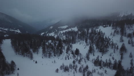aerial drone shot of snowy mountain landscape