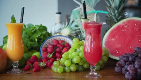 Left-to-right-panning-shot-of-fresh-fruits-and-freshly-made-fruit-juice-and-smoothies