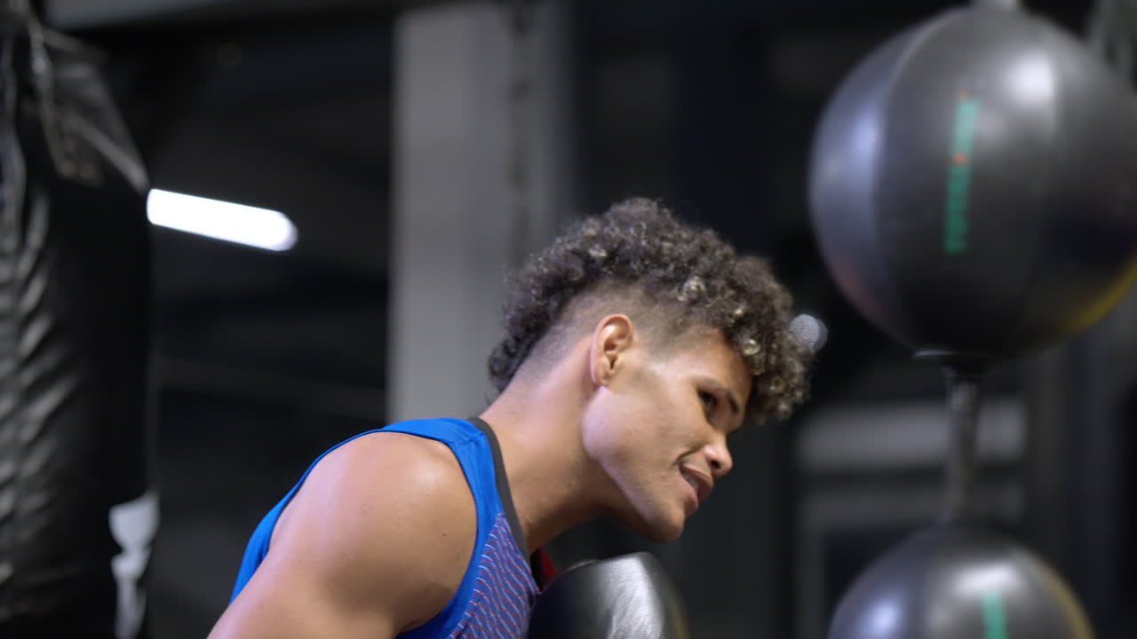Man training boxing in gym