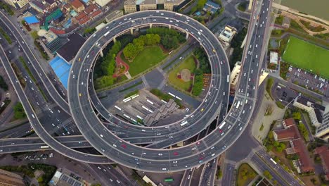 aerial view of roundabout of nanpu bridge, shanghai downtown, china. financial district and business centers in smart city in asia. top view of skyscraper and high-rise buildings.