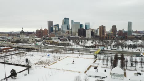 drone flies over minnesota sculpture garden on cold winter day