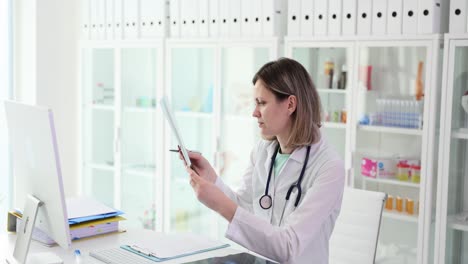 a doctor examining an x-ray in a medical office