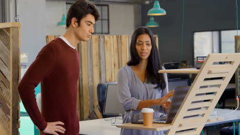 executives discussing over laptop in the office 4k