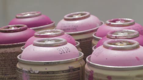 Group-of-Used-Empty-Pink-Spray-Paint-Cans