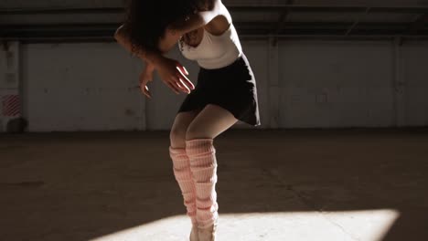 Female-dancer-in-an-empty-warehouse