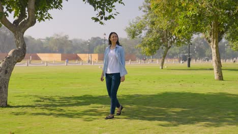 Indian-woman-walking-in-a-park