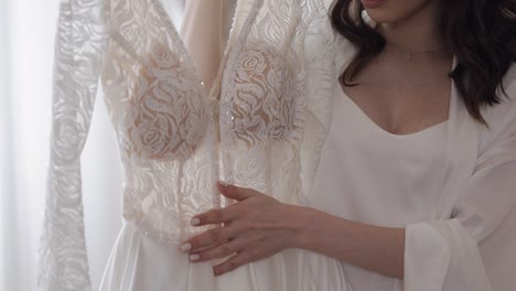 bride trying on a wedding dress