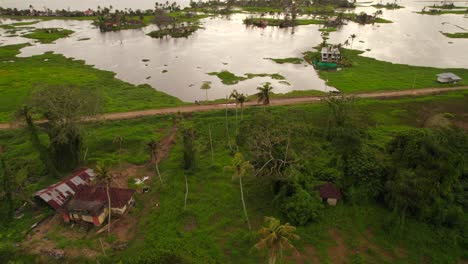 aerial flying over flooded rural land in south east asia due to climate change