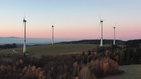 wind turbines park in a colorful twilight landscape