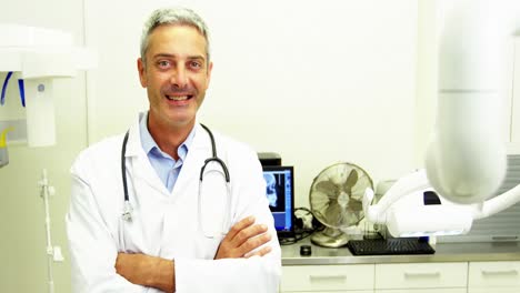 Dentist-smiling-at-camera