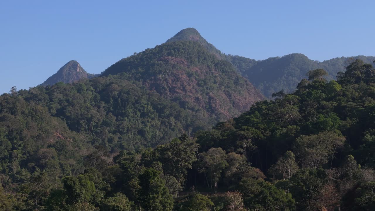 Drone perspective of mountains on Koh Chang. Sunny morning aerials of Thailand's coastal beauty on the island of Koh Chang