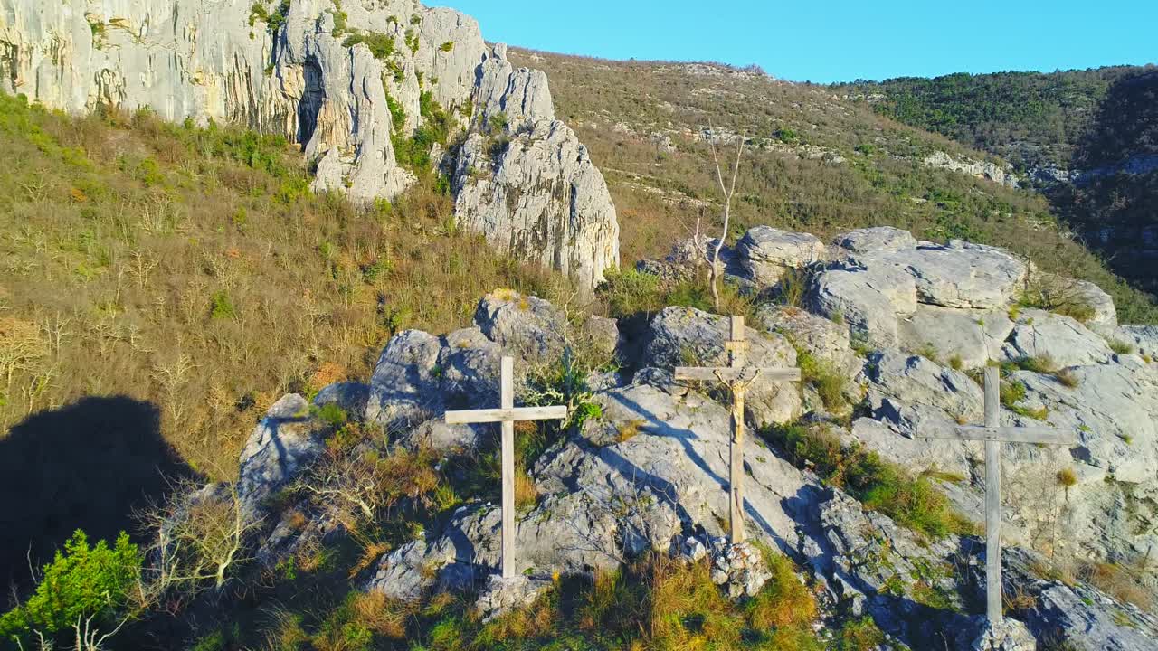fly over Christian wood cross, crucifix, on top of cliff. Motovun, Croatia