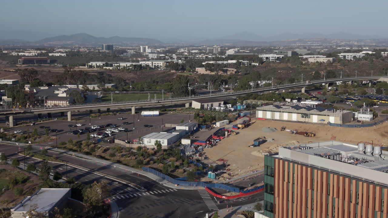 The new San Diego blue line trolley station platform at UCSD Medical Center on Nobel Drive. Wide aerial shot