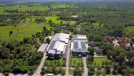 aerial view of large scale solar panels on modern factory roof