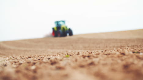 Farmer-Plowing-Field-Using-Harrows