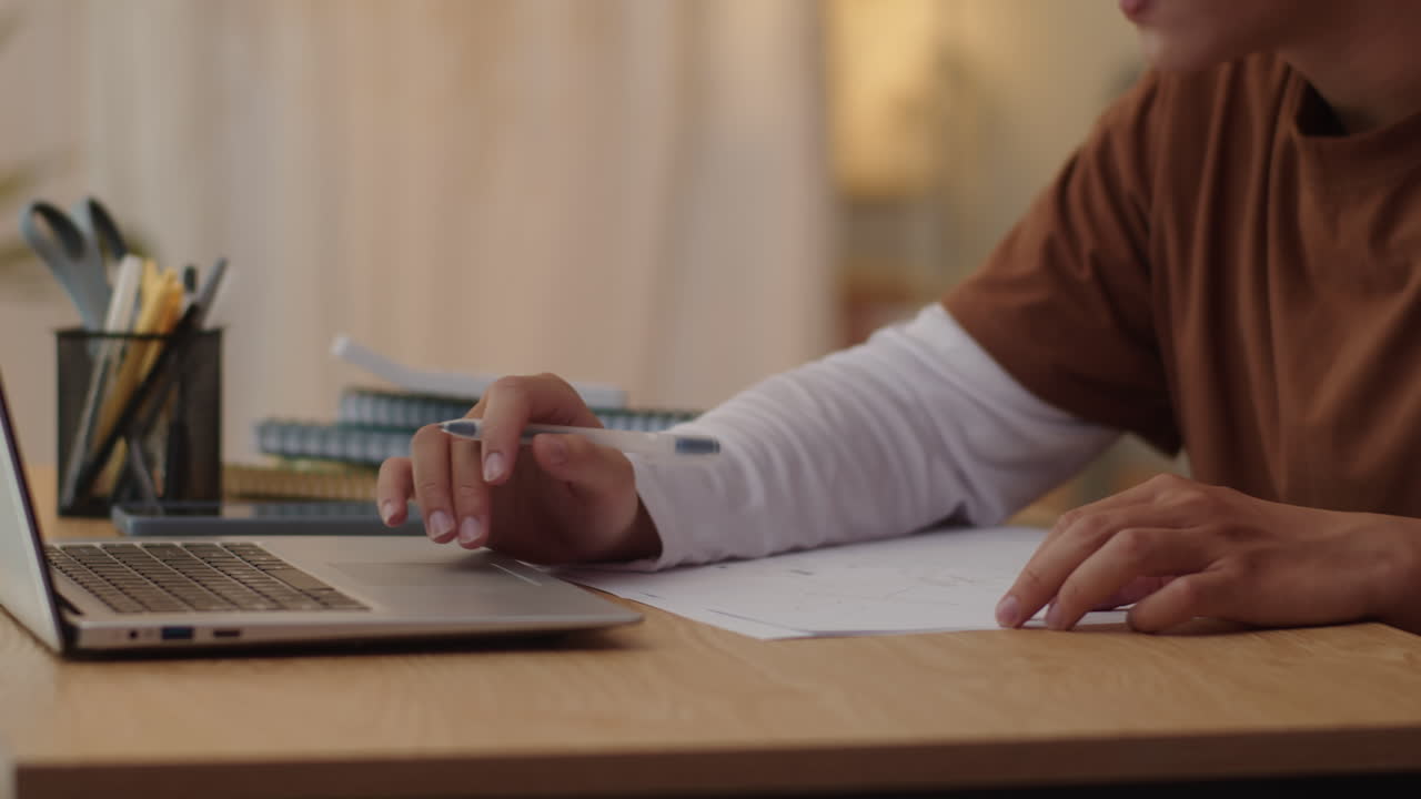 Student Using PC while Passing Online Exam from Home