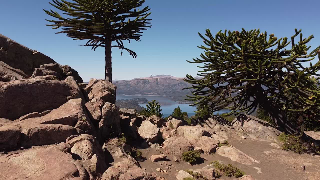 Revealing aerial of magnificent natural landscape with lake and mountains in distance, recording location Patagonia, Argentina, South America