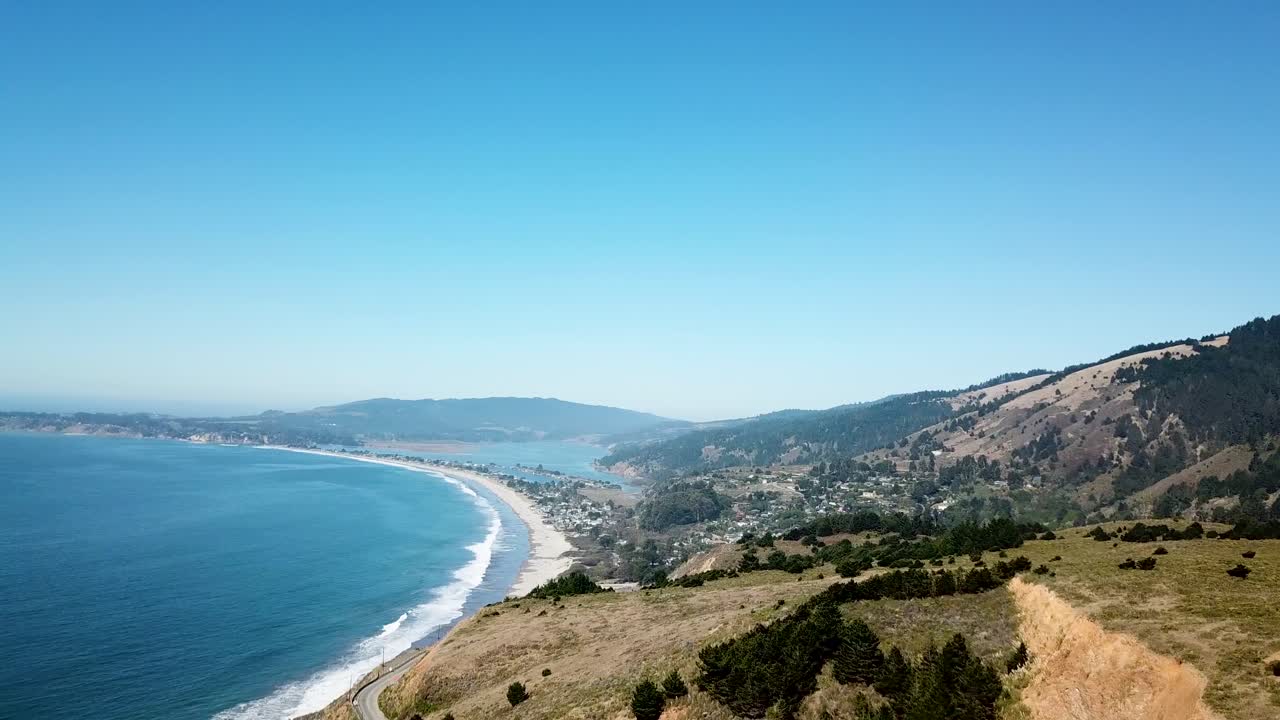 Drone shot revealing the beautiful Stinson beach in California, USA on a gorgeous sunny afternoon