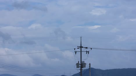 telephone pole of timelapse moving clouds