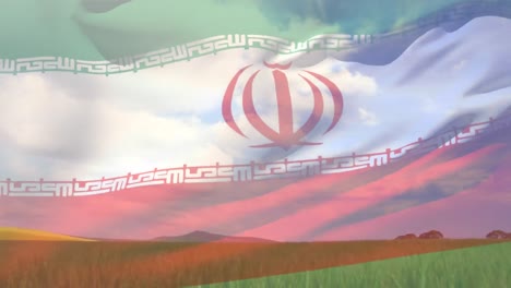 composición digital de ondear la bandera de irán contra la vista del paisaje del campo agrícola