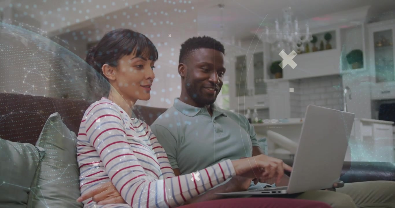 Vertical video: Pointing woman in striped top and man using laptop on sofa to check info, overlays