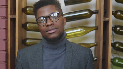 portrait of handsome black businessman in restaurant