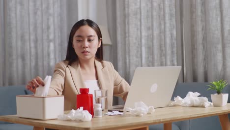 woman working from home while sick