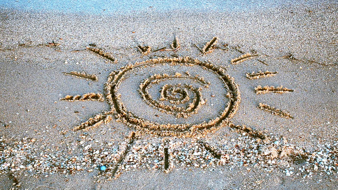 Sun drawing on the beach. Beach and drawing