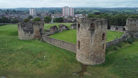 Flint-castle-Welsh-medieval-coastal-military-fortress-ruin-aerial-view-right-orbit-low