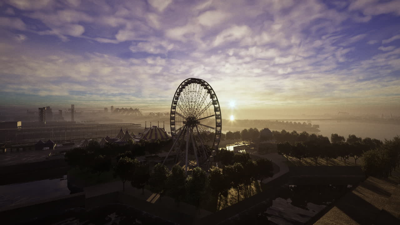 Ferris wheel and amusement park at sunrise near waterfront