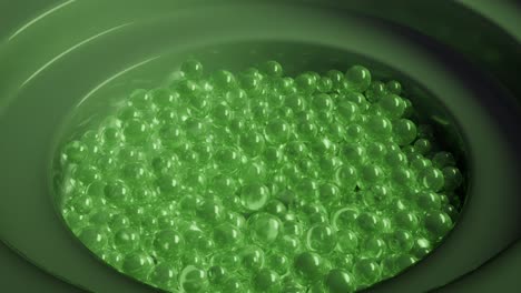 abstract 3d render of green spheres in concentric circles