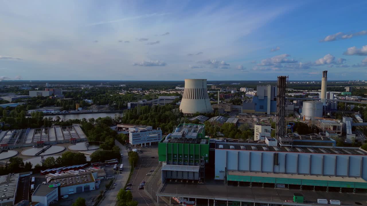 Waste incineration plant, waste to new energy sources, polluting the atmosphere and contributing to climate change. Fantastic aerial view flight fly reverse drone