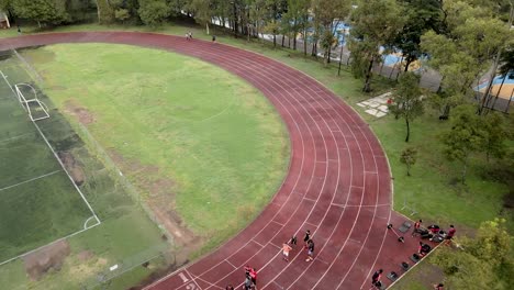 aerial view of athletes training on a running track