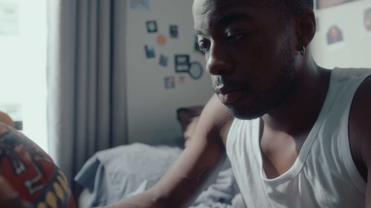 Black Athlete with Basketball Thinking about Game