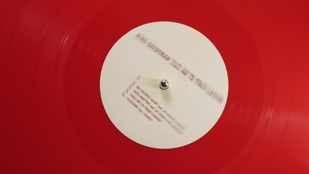 Retro Vinyl record player playing music, close-up macro shot of vintage LP disc old phonograph spinning. Retro music player.