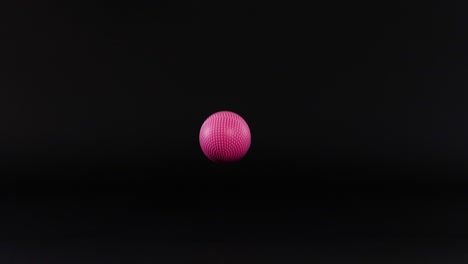 pink ball moves across a black grid