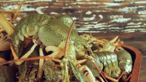 live crayfish on a wooden table